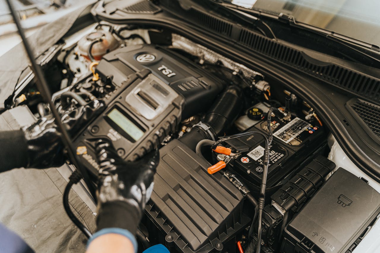 a mechanic inspecting a car battery