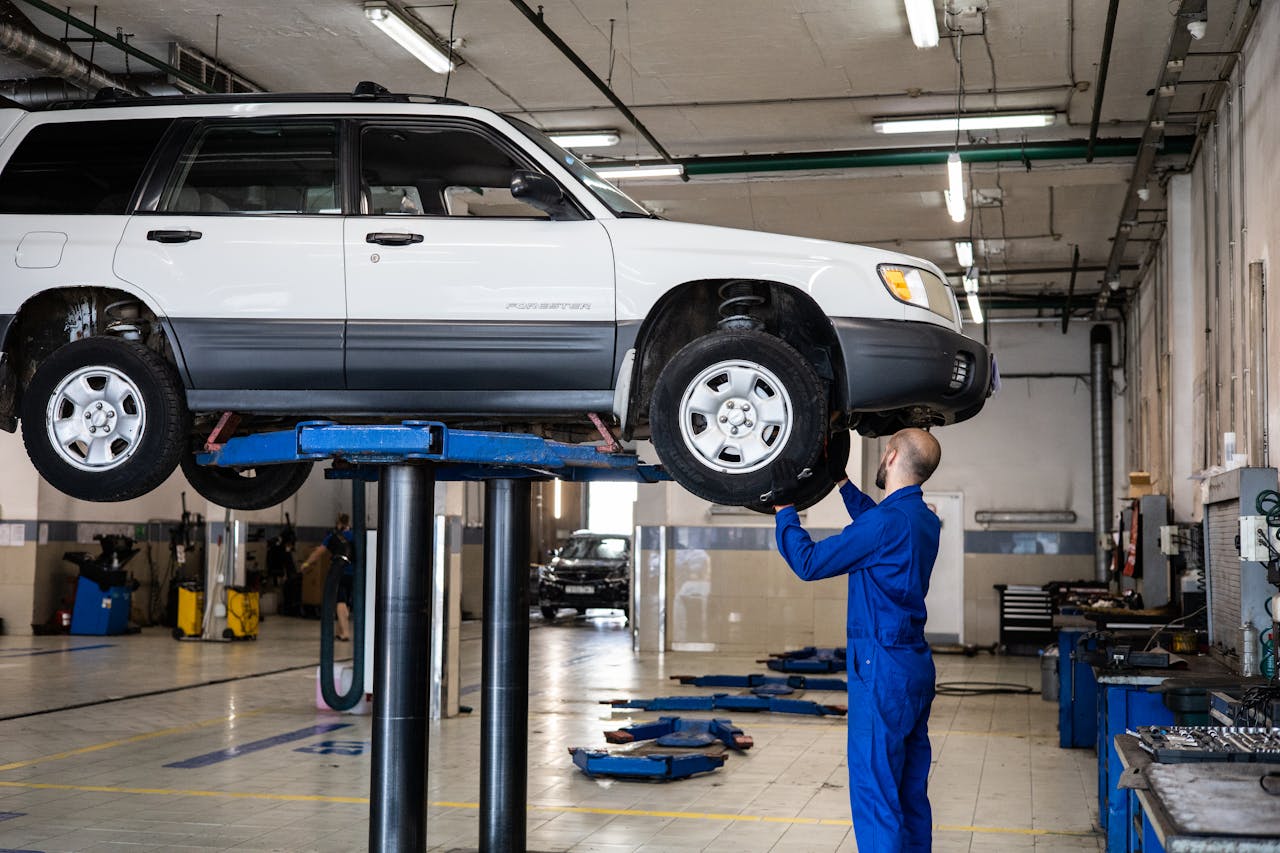 a man is checking a car with a recall