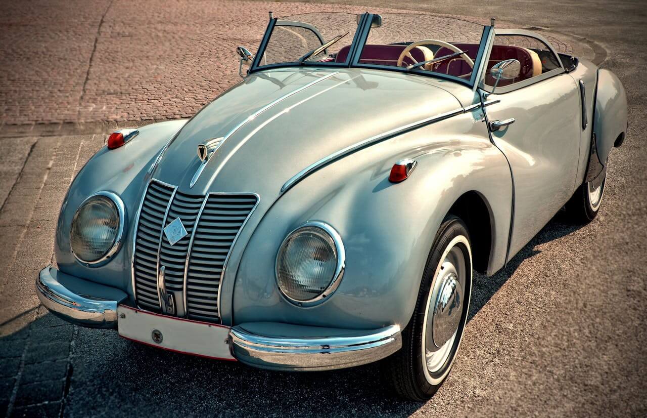 a classic convertible on the road