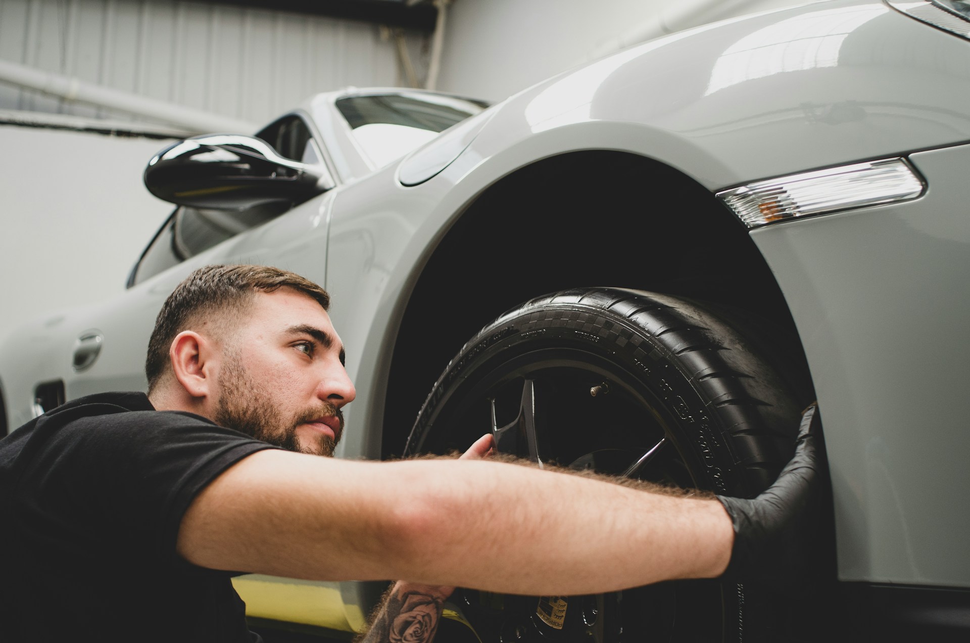 a professional mechanic near a car