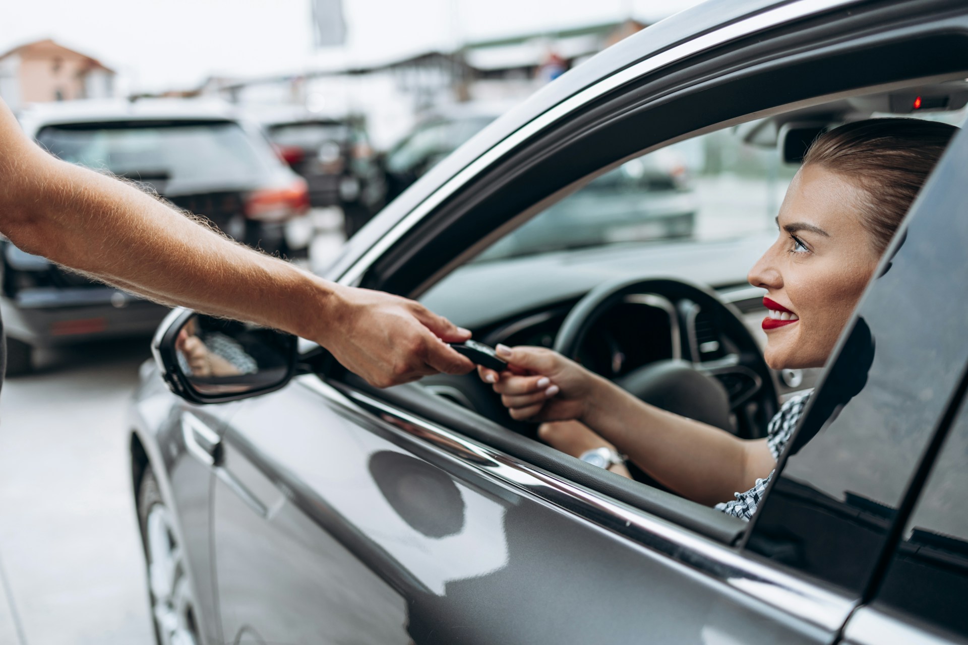 happy new driver in her car