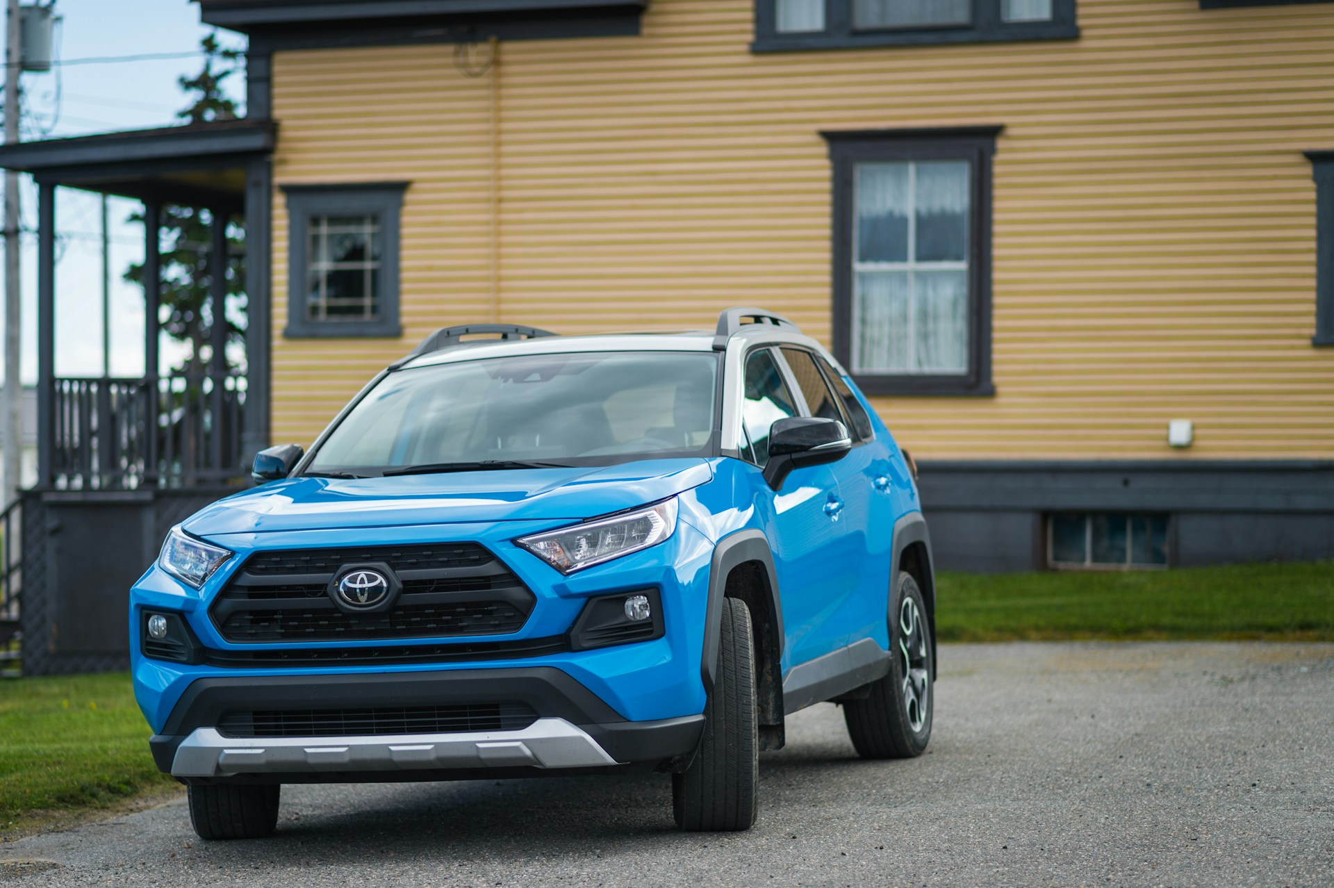 roomy Toyota SUV near a house