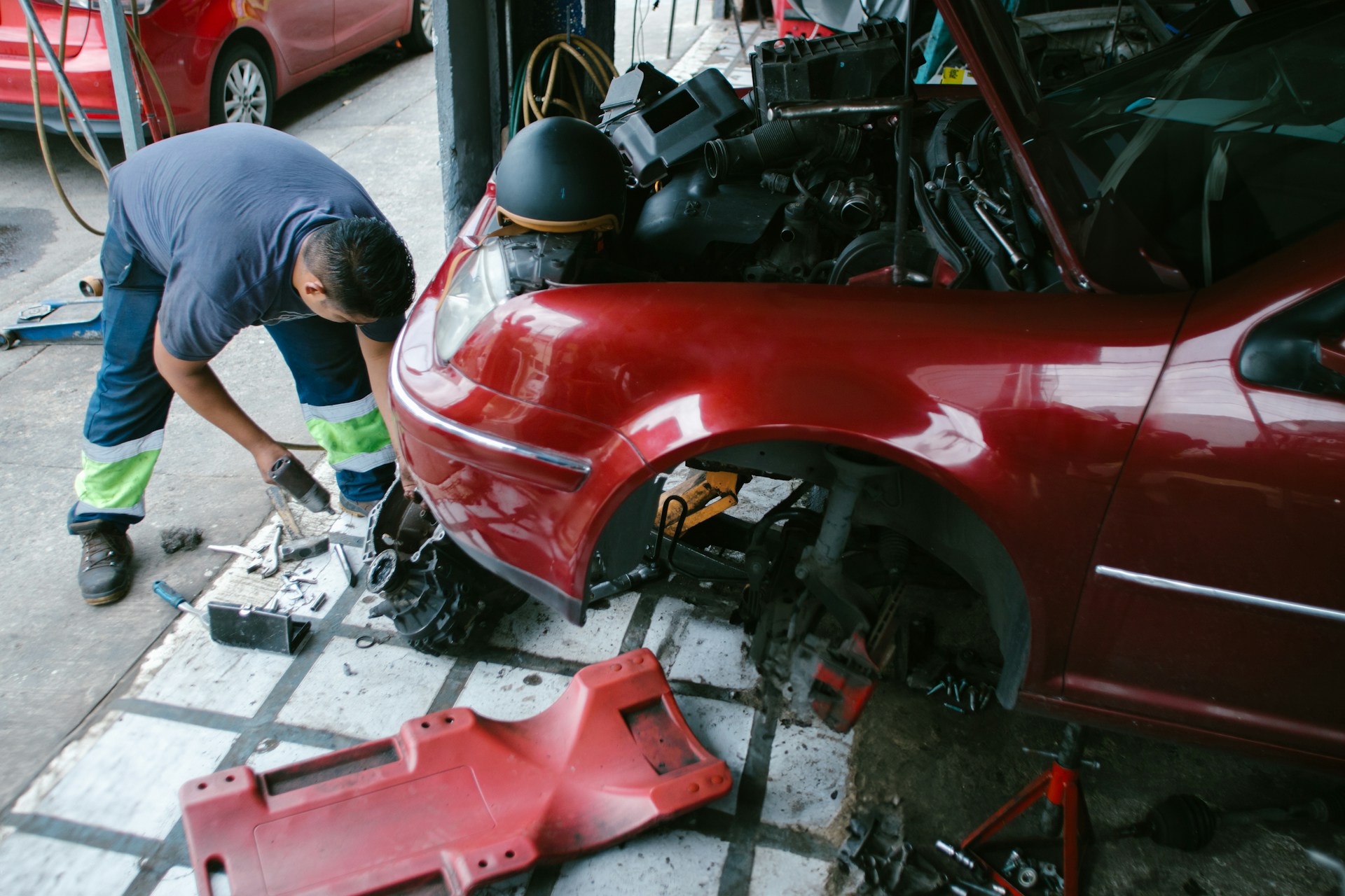 mechanic repairing a car with a damaged frame