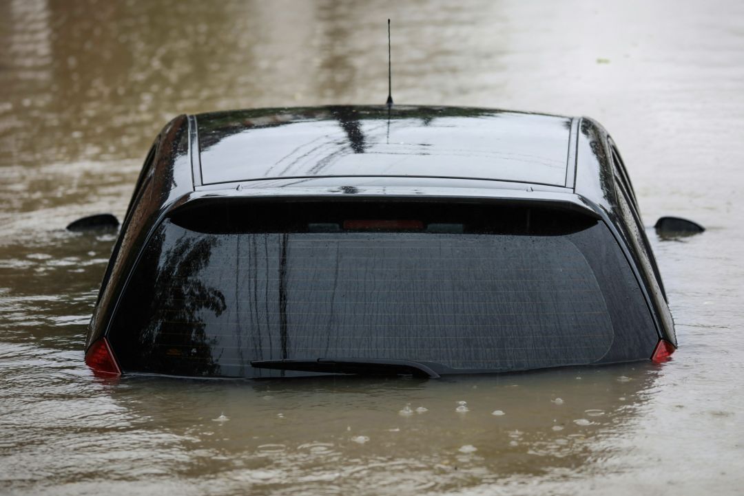 partially submerged car in floodwater